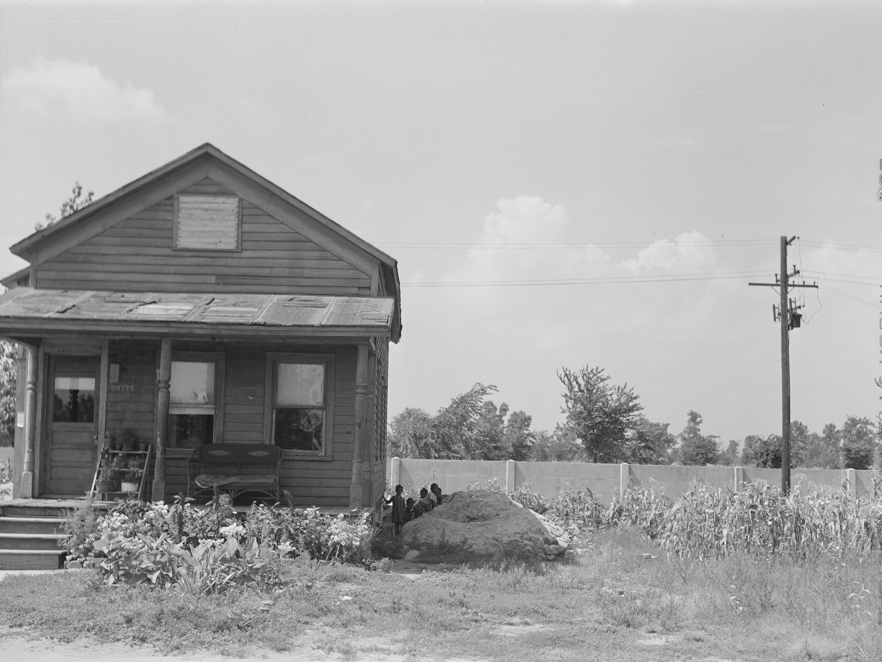 A house on Birwood Street in Detroit, 1941, with the segregation wall running behind it